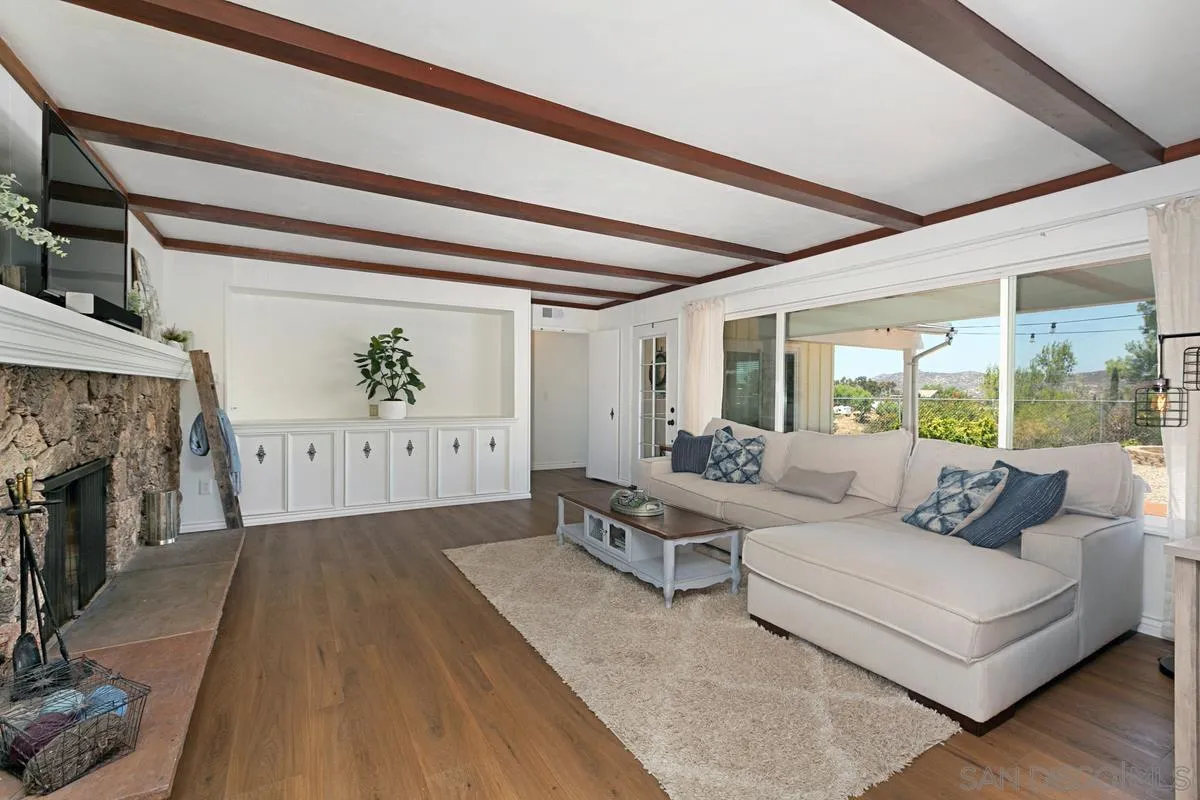 11615 Westridge Place Lakeside, CA 92040 - Photo 7 of 29 a living room with furniture and a fireplace