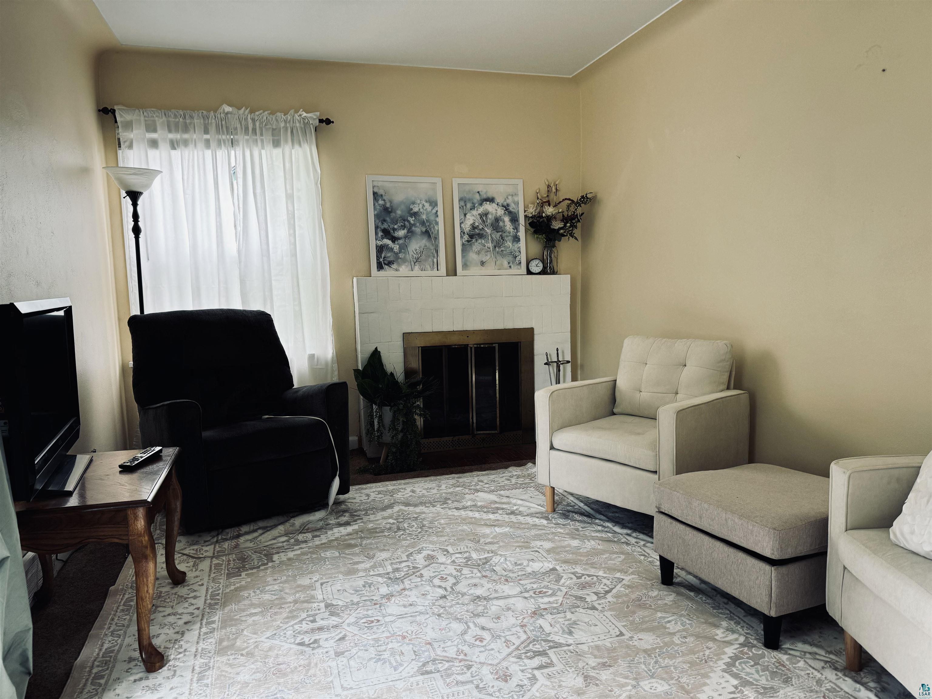 4416 Oneida Street Duluth, MN 55804 - Photo 12 of 12 Living room featuring a tiled fireplace