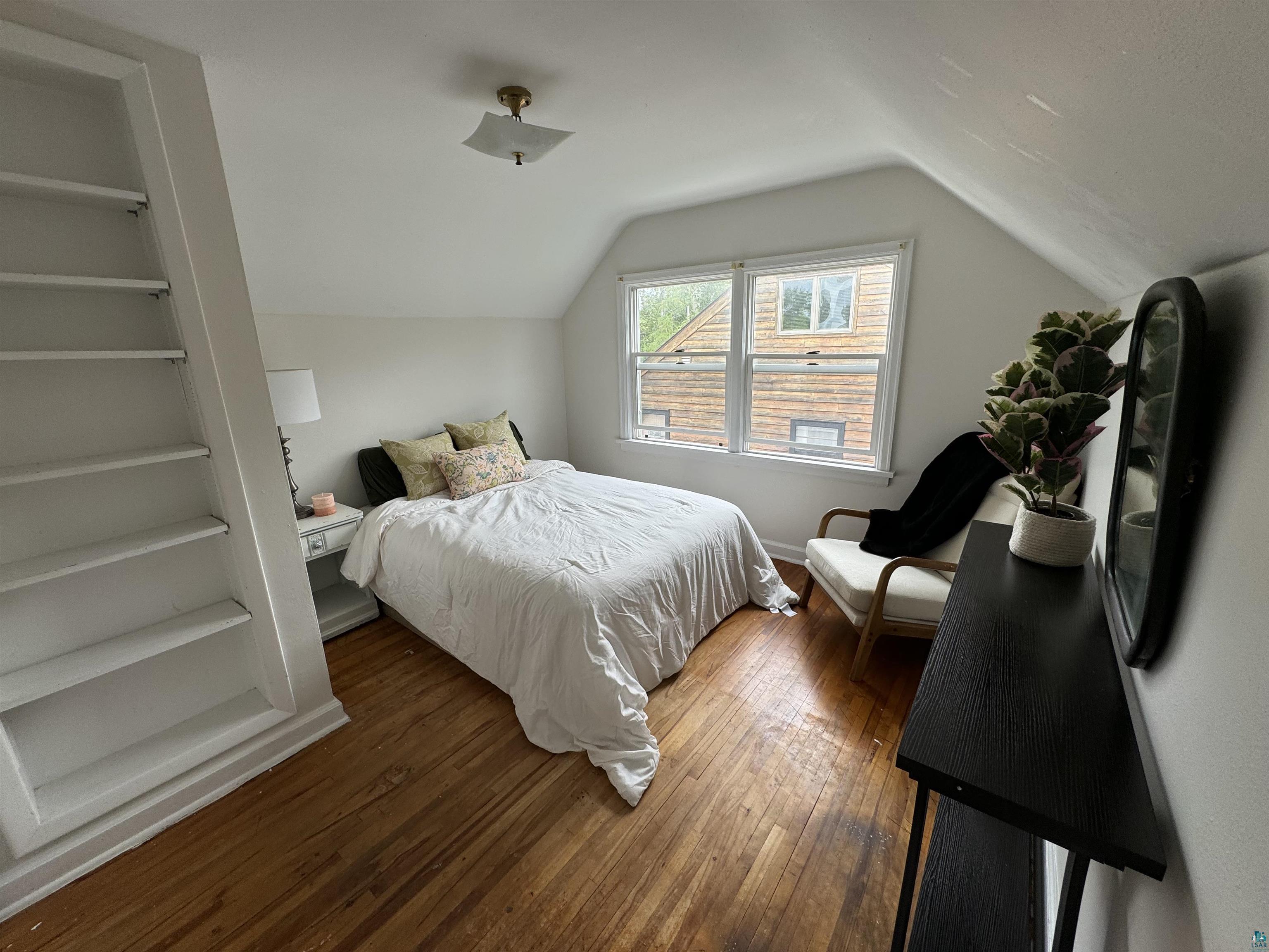4416 Oneida Street Duluth, MN 55804 - Photo 3 of 12 Bedroom with vaulted ceiling and dark hardwood wood-style floors