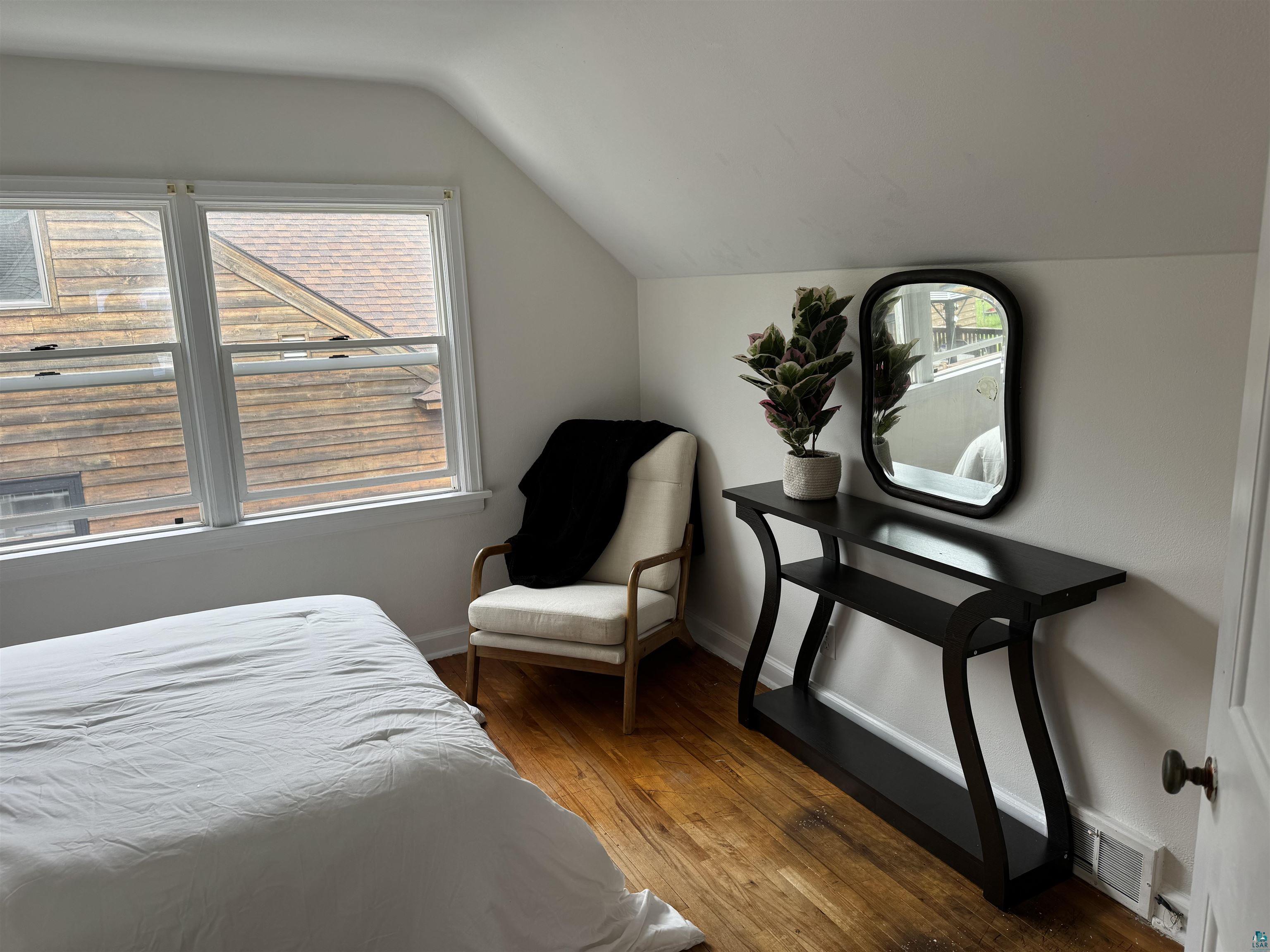 4416 Oneida Street Duluth, MN 55804 - Photo 5 of 12 Bedroom featuring vaulted ceiling and hardwood / wood-style floors