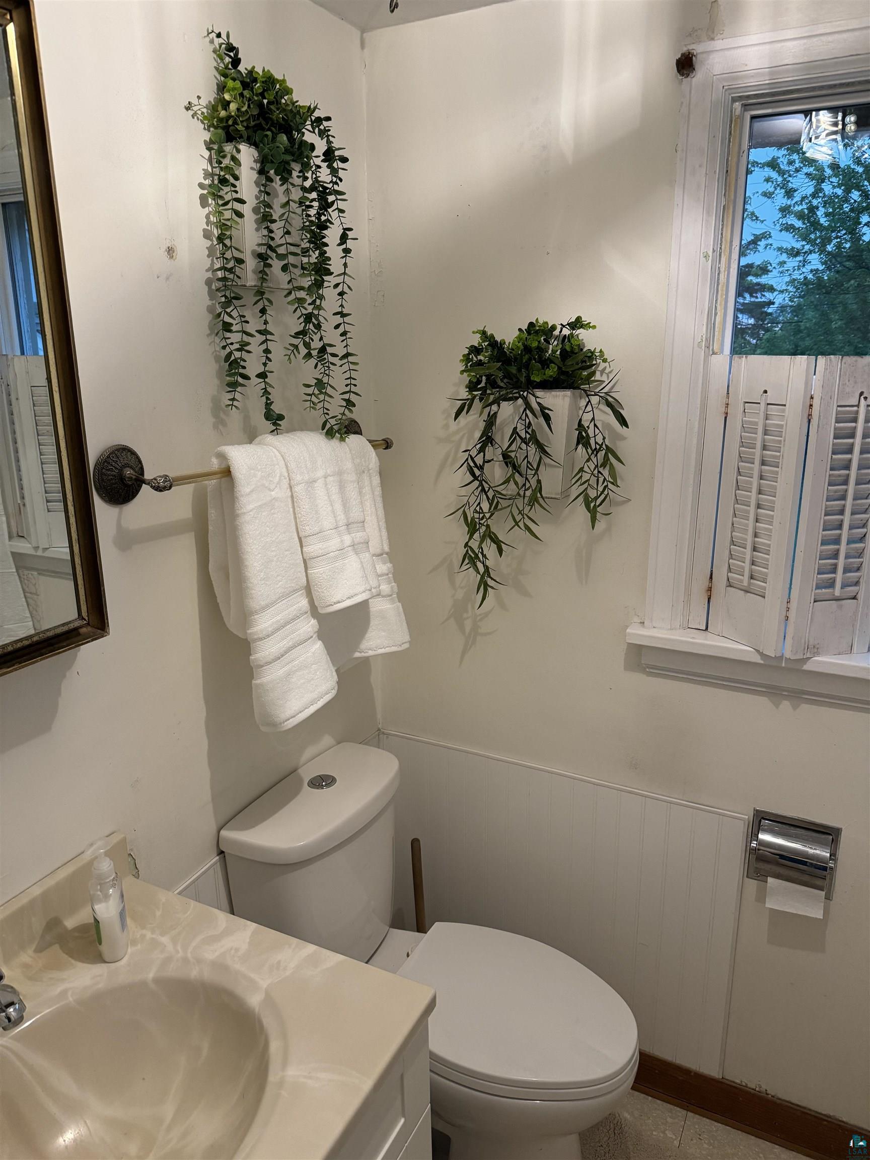 4416 Oneida Street Duluth, MN 55804 - Photo 9 of 12 Bathroom with large vanity and toilet