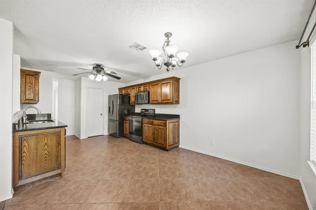 a view of a kitchen with a sink