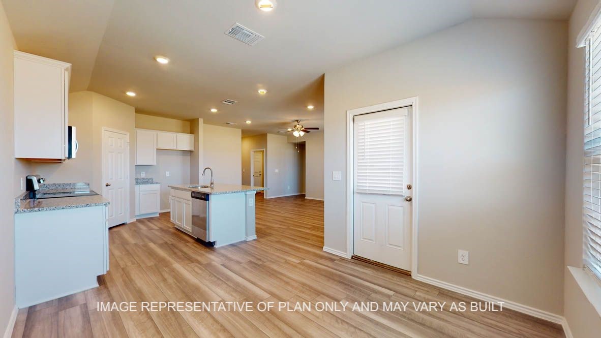 2912 Taddy Road Lorena, TX 76655 - Photo 6 of 22 a kitchen with a refrigerator and a stove top oven