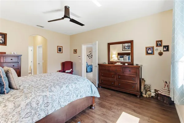 a bedroom with a bed and a dresser