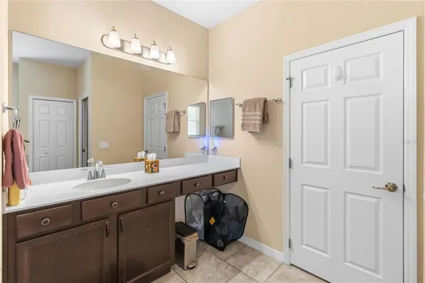 a bathroom with a double vanity sink a mirror and a