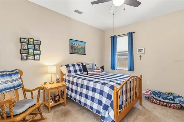 a bedroom with a bed and a table in it