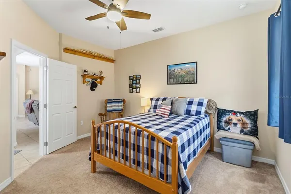 a bedroom with a bed and a table