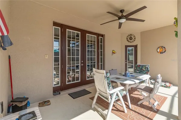 a view of a dining room with furniture and a window