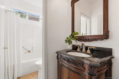 a view of a sink and a kitchen