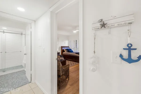 a view of a hallway with a living room
