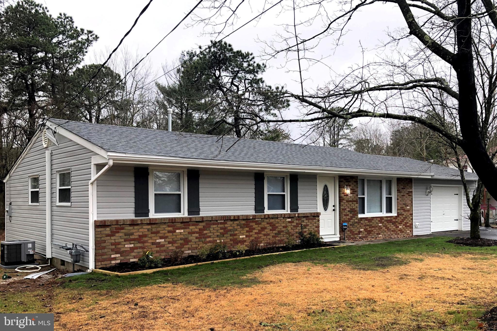 102 Haddon Road Browns Mills, NJ 08015 - Photo 1 of 12 a front view of a house with a yard