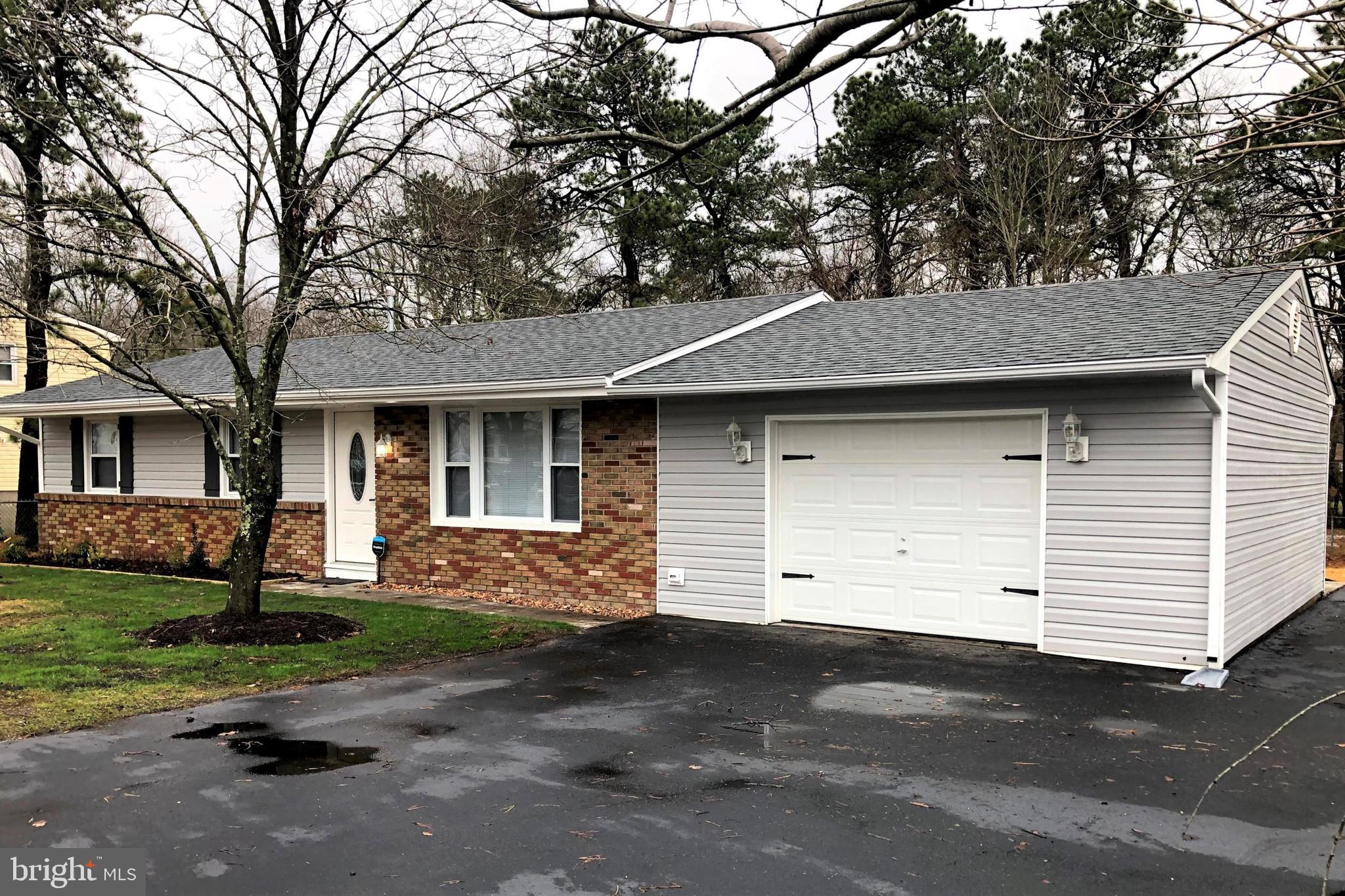 102 Haddon Road Browns Mills, NJ 08015 - Photo 2 of 12 a front view of a house with a yard