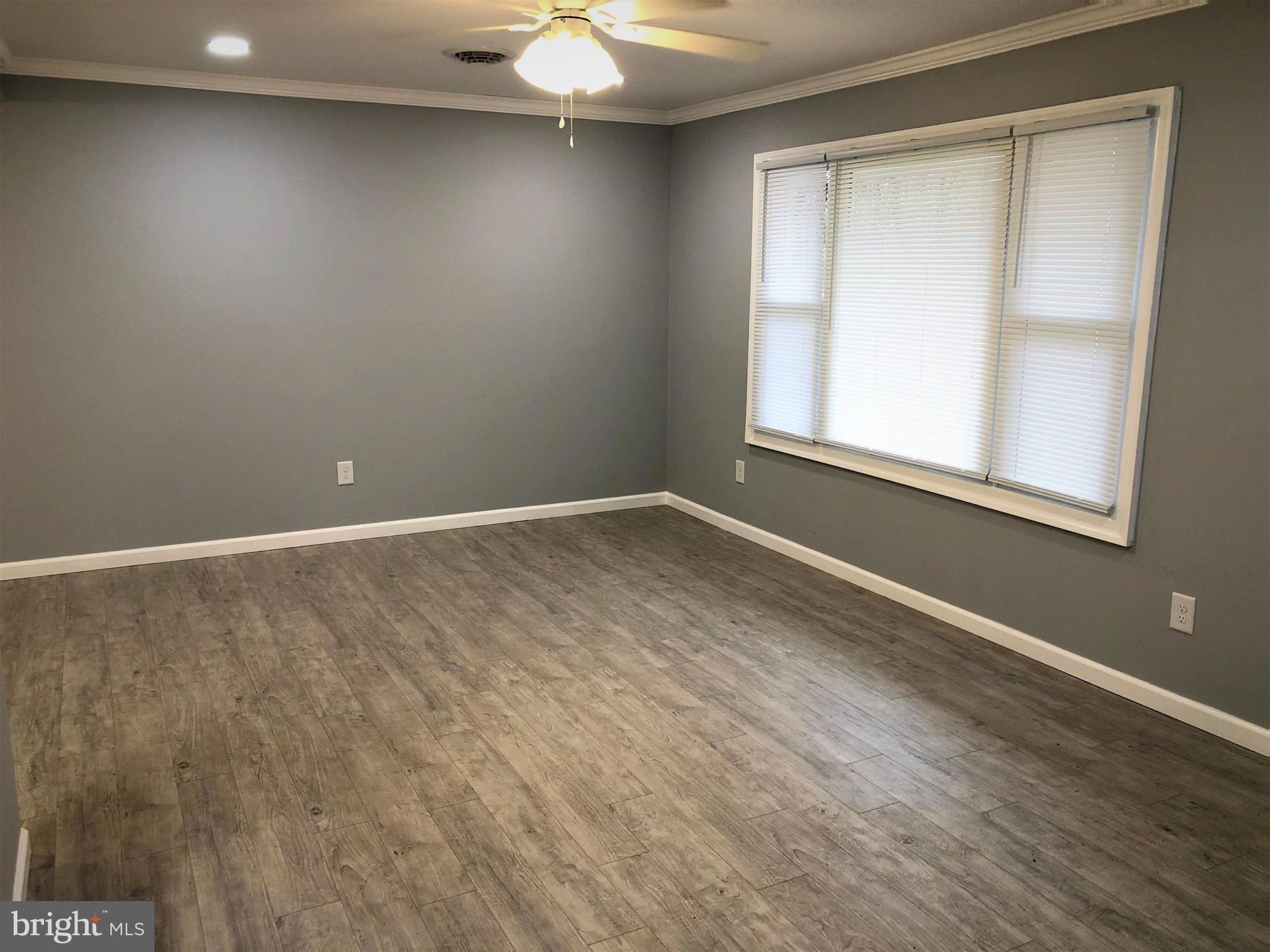 102 Haddon Road Browns Mills, NJ 08015 - Photo 3 of 12 an empty room with a window