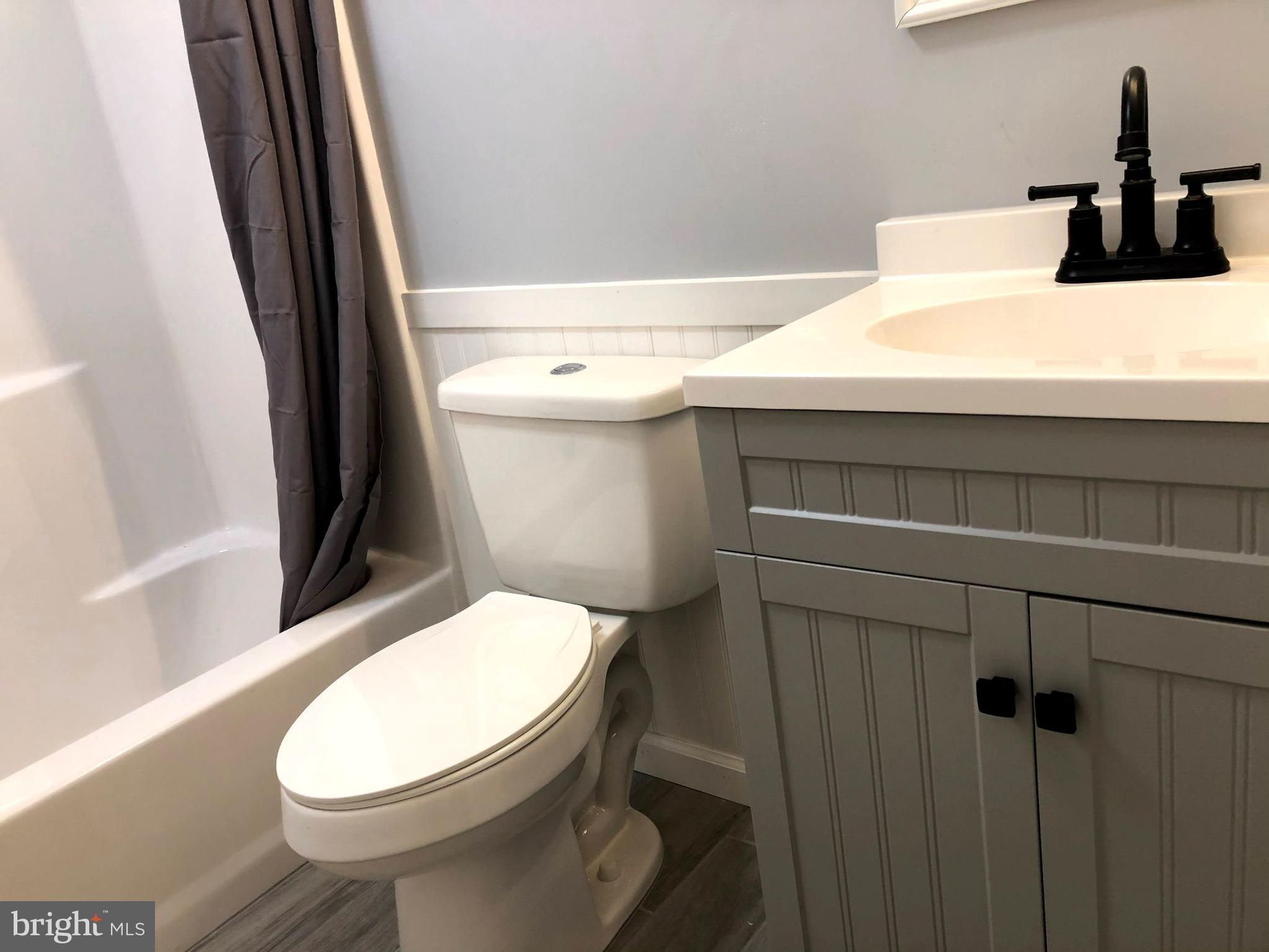 102 Haddon Road Browns Mills, NJ 08015 - Photo 9 of 12 a bathroom with a toilet and a sink