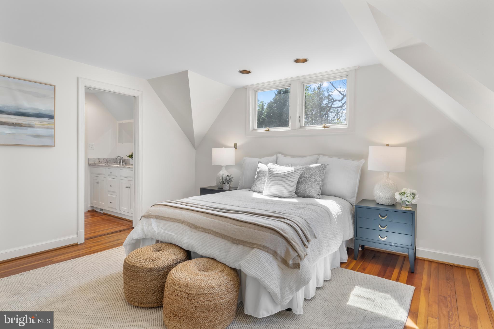 5624 Madison Street Bethesda, MD 20817 - Photo 16 of 28 a bedroom with a bed and wooden floor