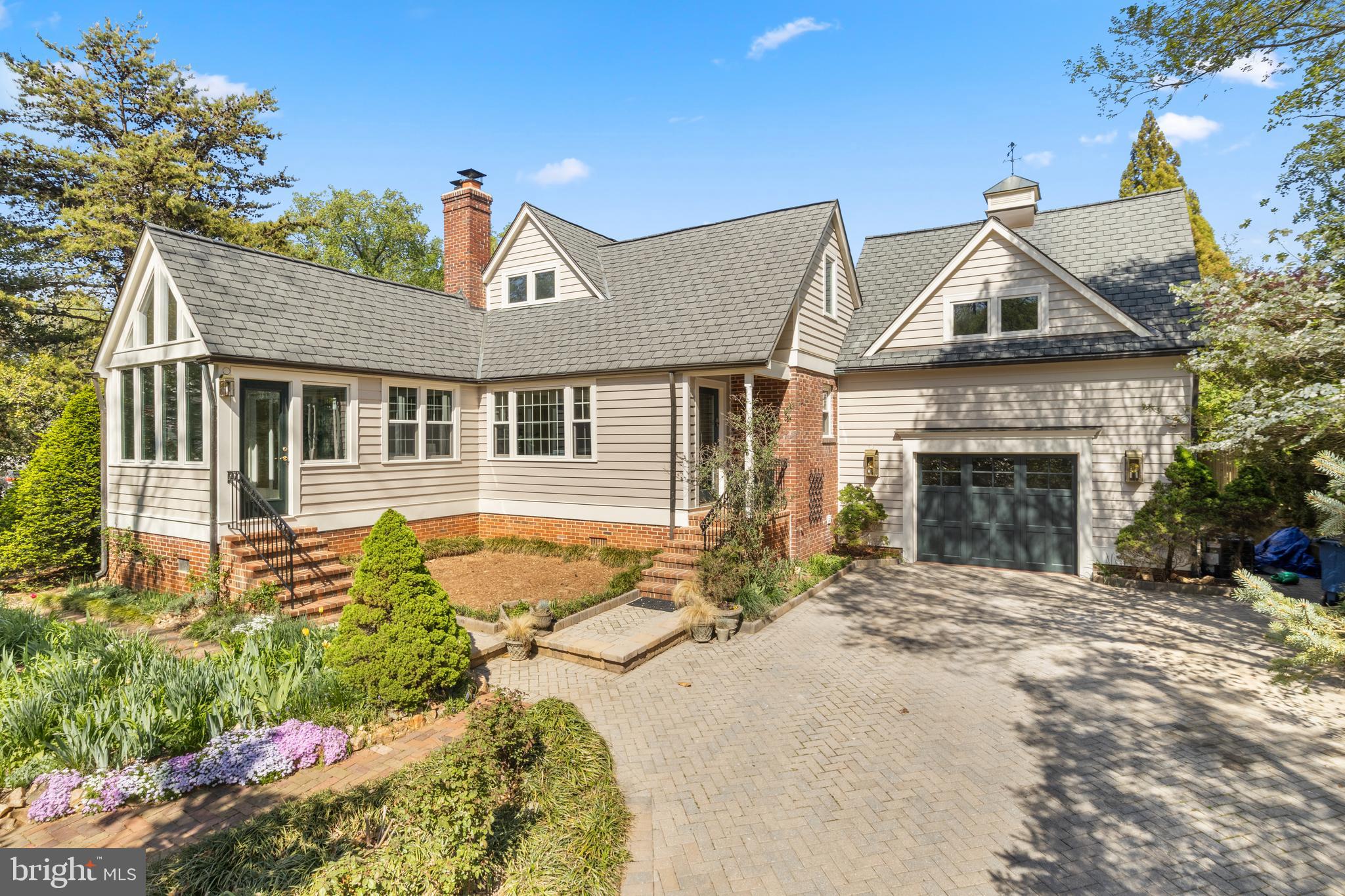 5624 Madison Street Bethesda, MD 20817 - Photo 2 of 28 a front view of a house with a yard