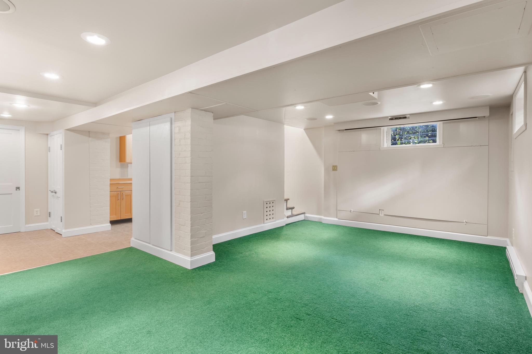 5624 Madison Street Bethesda, MD 20817 - Photo 24 of 28 a view of an empty room with a kitchen