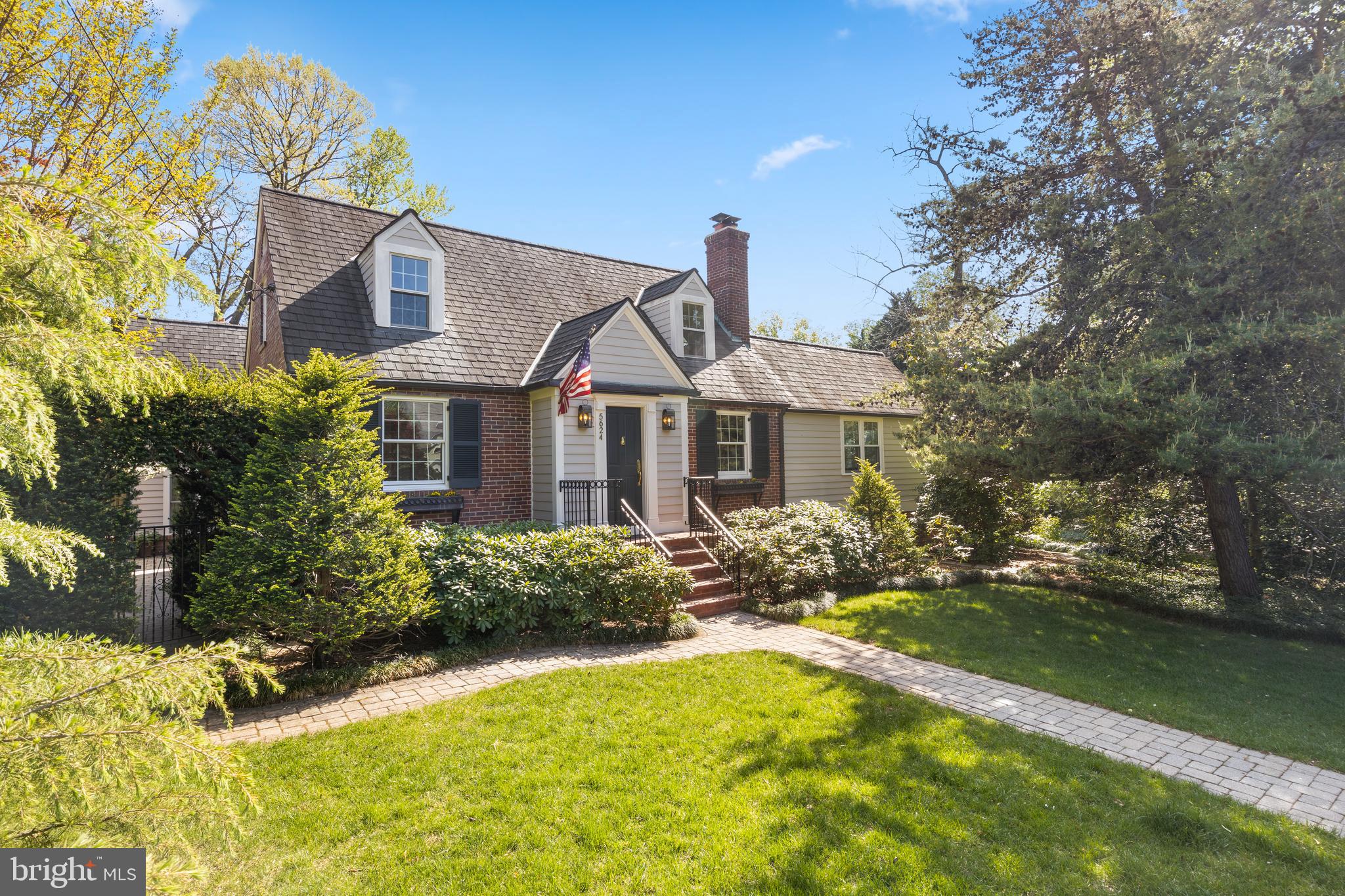 5624 Madison Street Bethesda, MD 20817 - Photo 28 of 28 a front view of a house with a yard