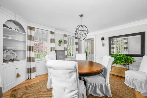 a bedroom with a bed table and a potted plant