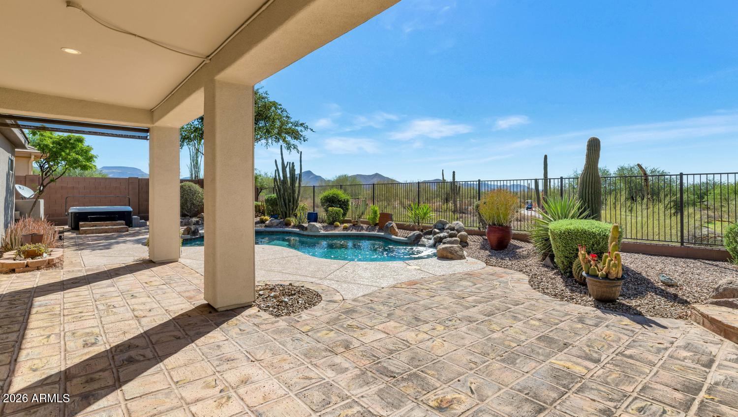41123 North River Bend Road Phoenix, AZ 85086 - Photo 26 of 45 a view of a chair and tables in the patio