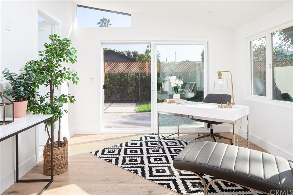 297 Rose Lane Costa Mesa, CA 92627 - Photo 11 of 17 a living room with furniture and a potted plant