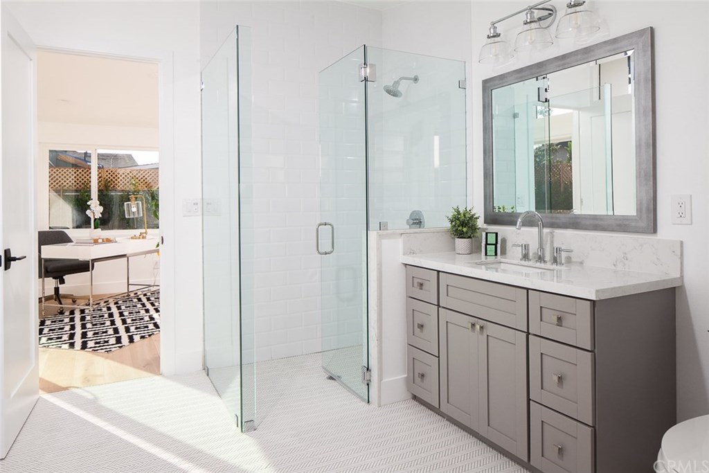 297 Rose Lane Costa Mesa, CA 92627 - Photo 12 of 17 a bathroom with a sink a toilet and shower