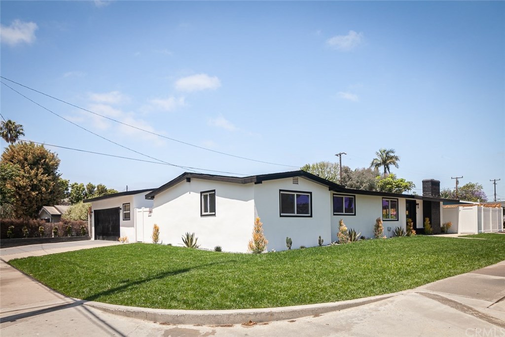 297 Rose Lane Costa Mesa, CA 92627 - Photo 14 of 17 a view of a house with a backyard