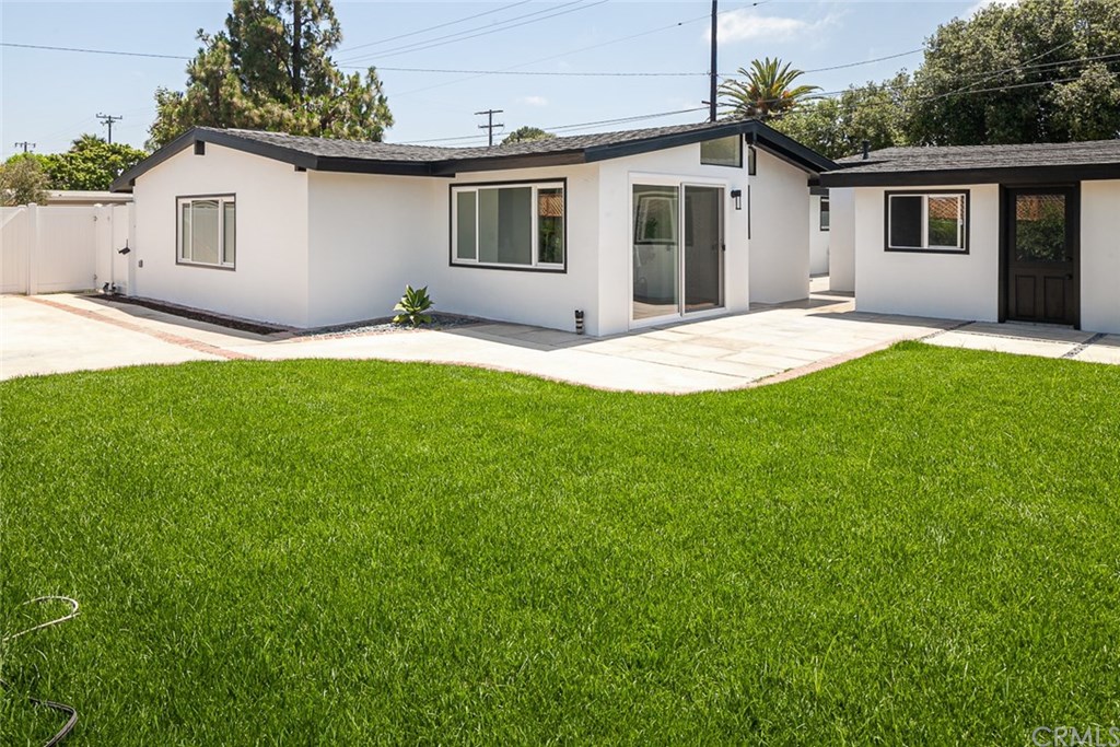 297 Rose Lane Costa Mesa, CA 92627 - Photo 15 of 17 a house that has a big yard in front of it