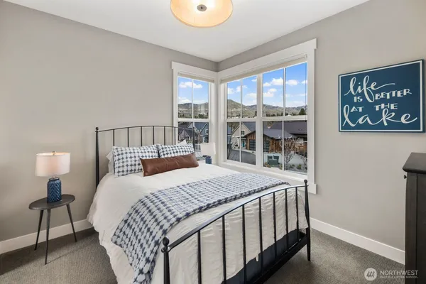 a bedroom with a large bed and a window