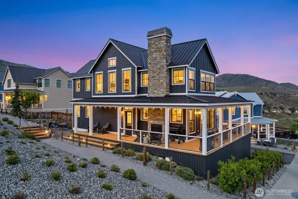 a front view of a house with a yard and balcony