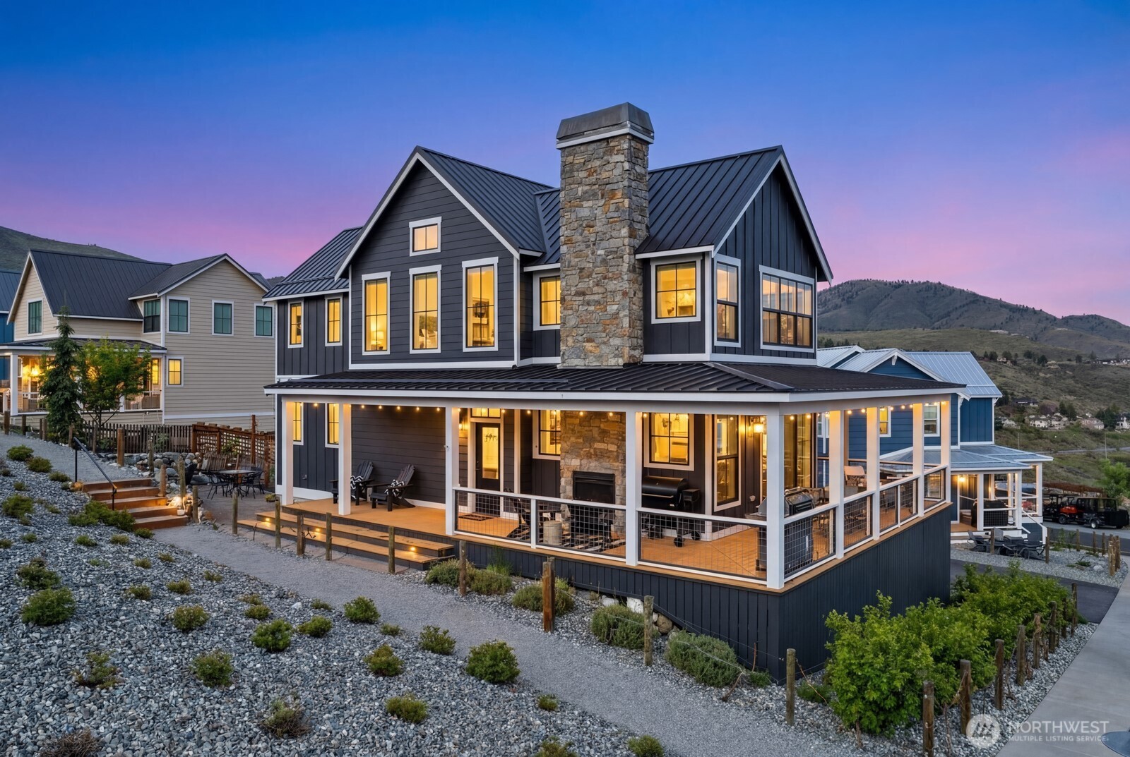 298 Bobcat Lane Chelan, WA 98816 - Photo 2 of 40 a front view of a house with a yard and balcony