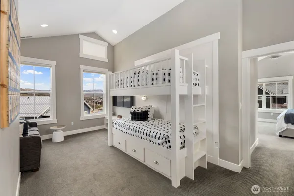 a bedroom with furniture and windows