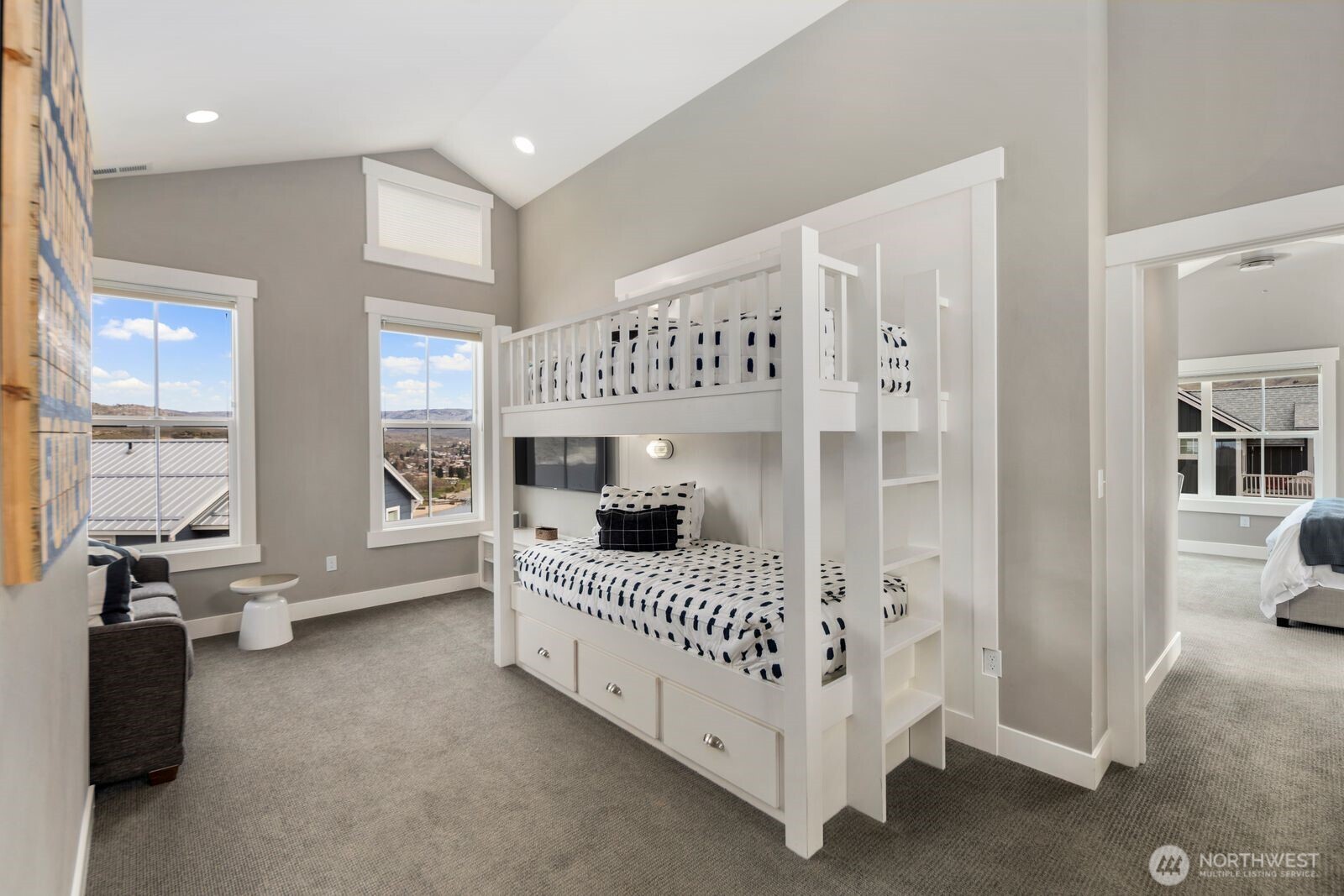 298 Bobcat Lane Chelan, WA 98816 - Photo 23 of 40 a bedroom with furniture and windows