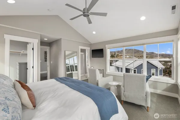 a bedroom with a large bed and a window
