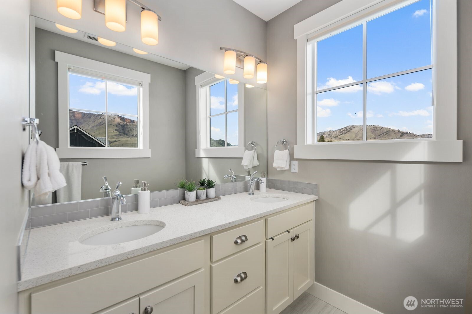 298 Bobcat Lane Chelan, WA 98816 - Photo 31 of 40 a bathroom with a double vanity sink and a mirror