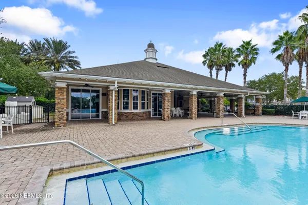 a view of a swimming pool with a yard