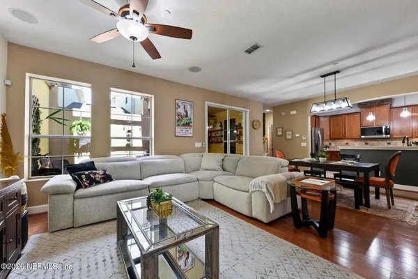 a living room with furniture and a large window