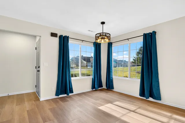 a view of an empty room and window