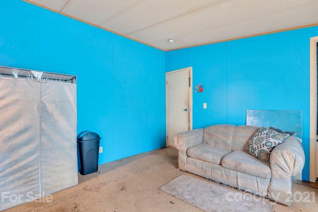 8414 Smith Road Stanfield, NC 28163 - Photo 22 of 23 a living room with furniture