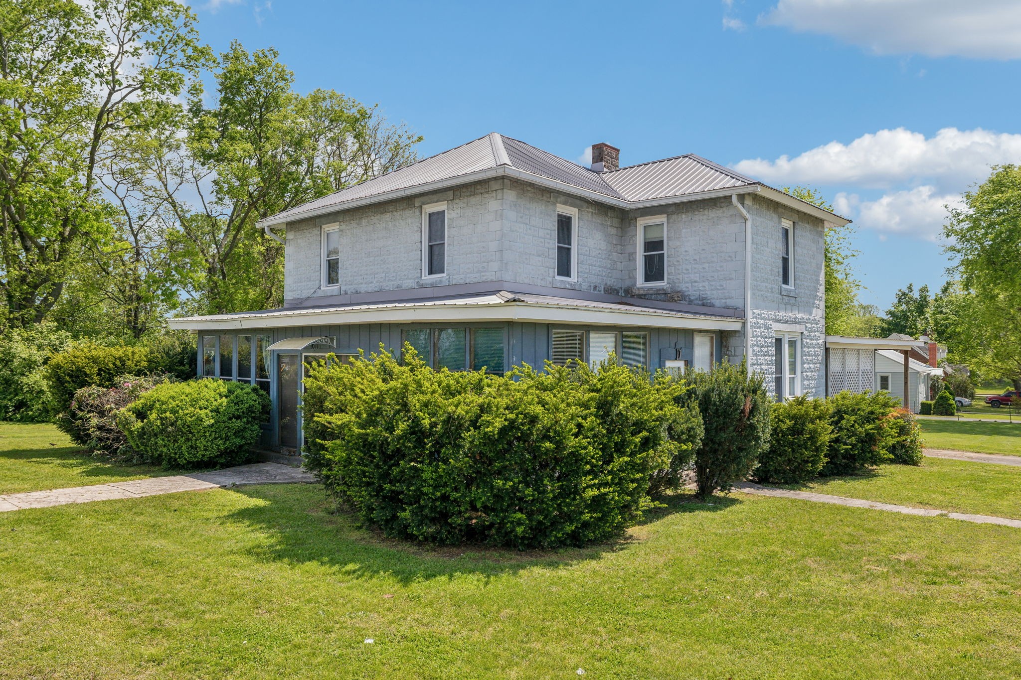 a front view of a house with garden