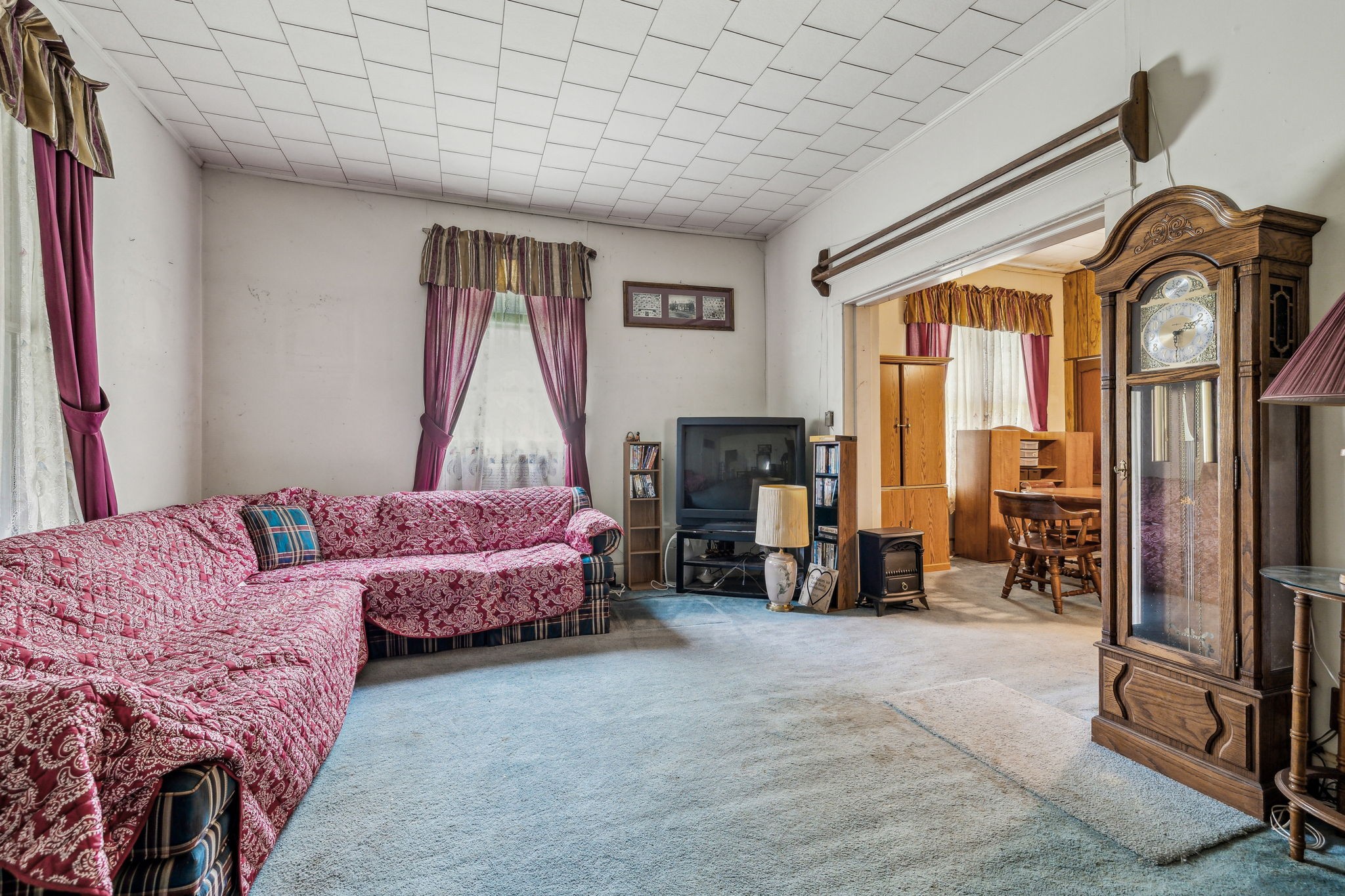 611 1st Avenue Mount Pleasant, TN 38474 - Photo 11 of 33 a bedroom with a bed and a large mirror next to a window
