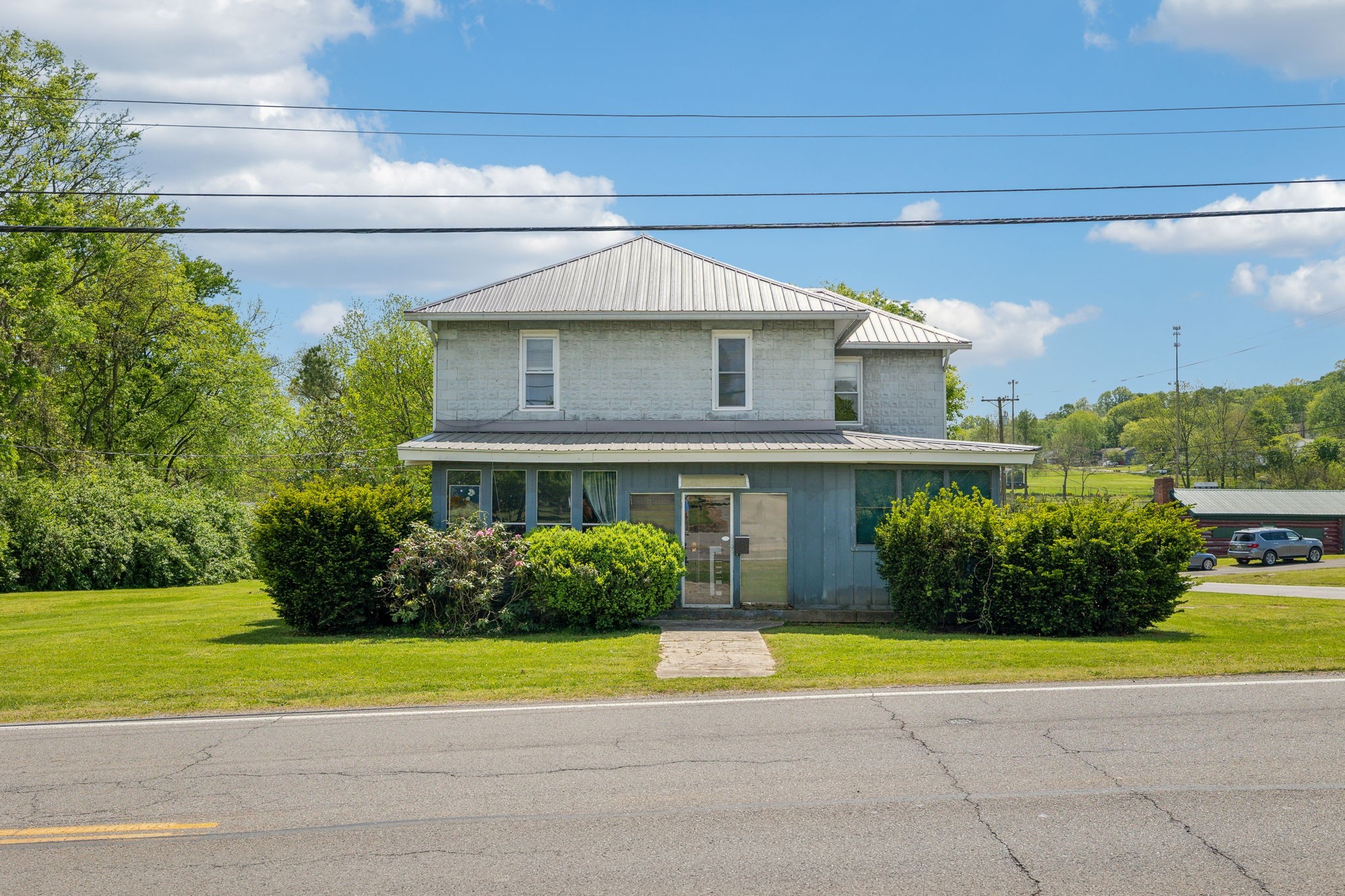 611 1st Avenue Mount Pleasant, TN 38474 - Photo 2 of 33 a view of a house with a swimming pool