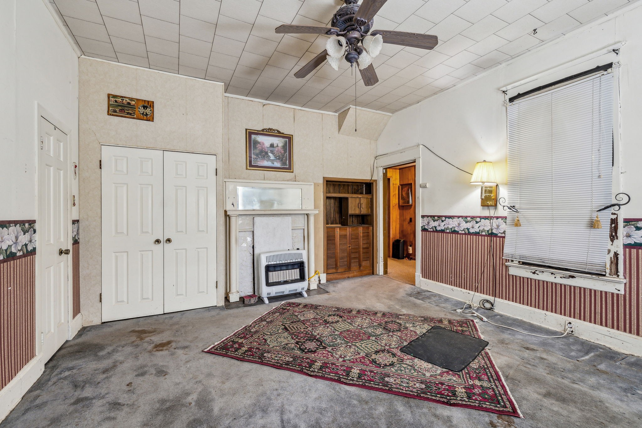 611 1st Avenue Mount Pleasant, TN 38474 - Photo 22 of 33 a living room with stainless steel appliances kitchen island granite countertop furniture and a fireplace
