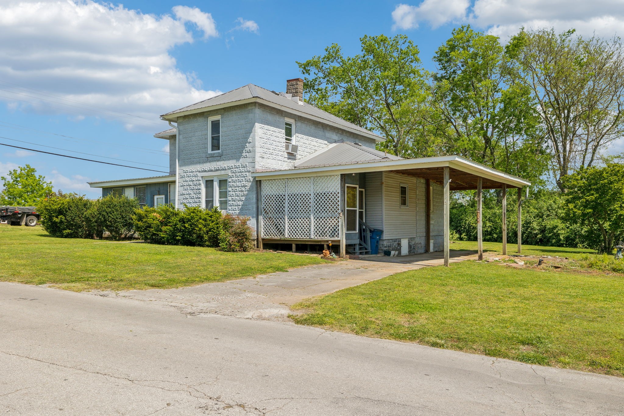 611 1st Avenue Mount Pleasant, TN 38474 - Photo 28 of 33 a front view of a house with a yard and trees