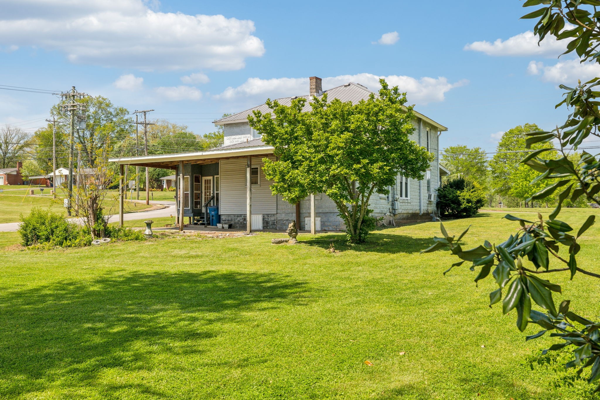 611 1st Avenue Mount Pleasant, TN 38474 - Photo 30 of 33 a front view of a house with a big yard