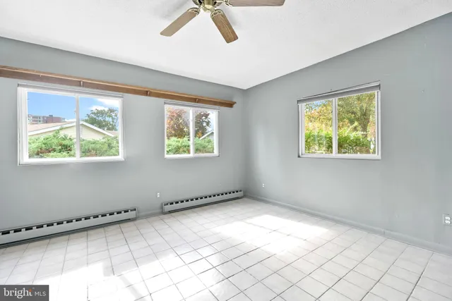 a view of an empty room with a window