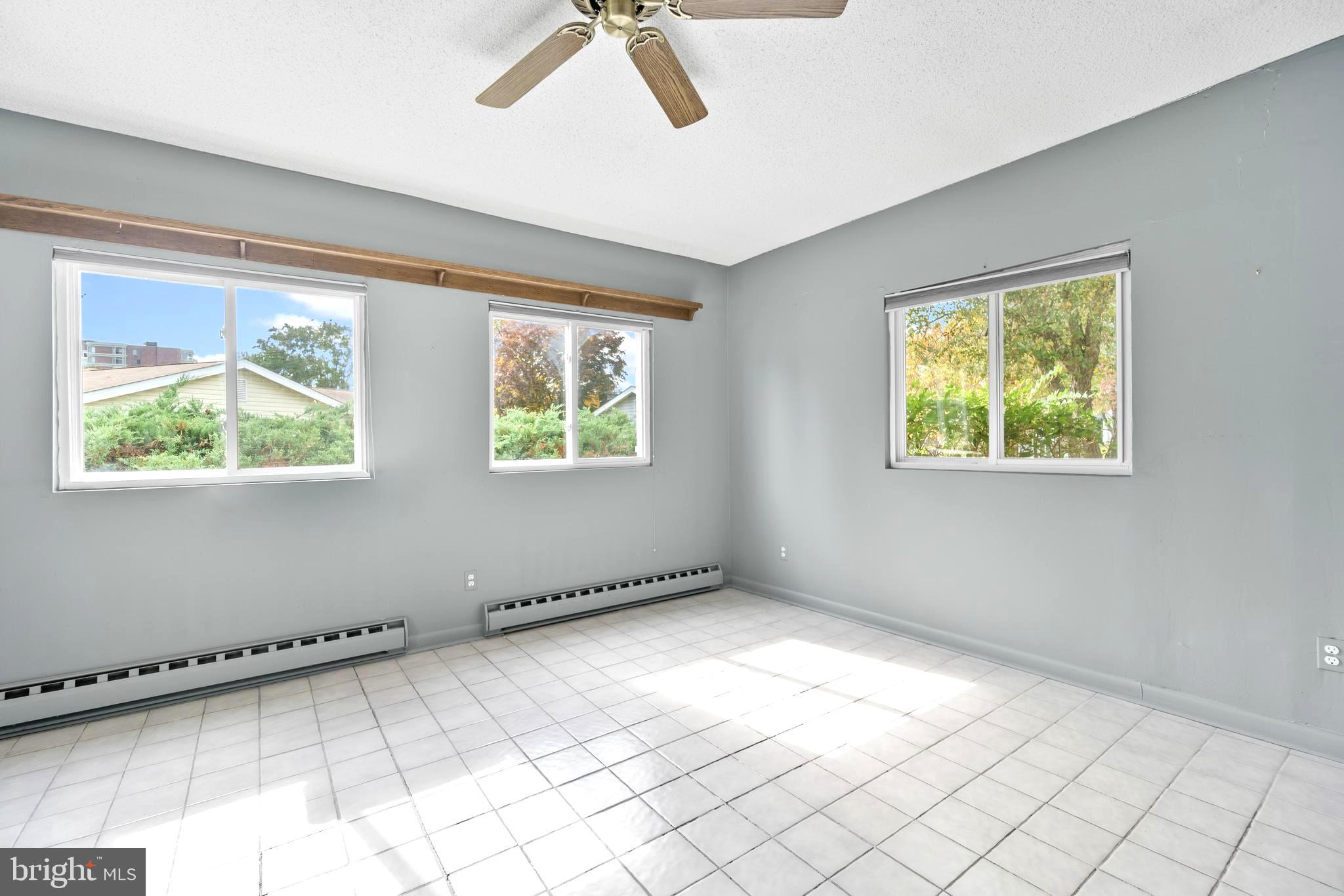 15524 Prince Frederick Way, Unit 118A Silver Spring, MD 20906 - Photo 13 of 31 a view of an empty room with a window