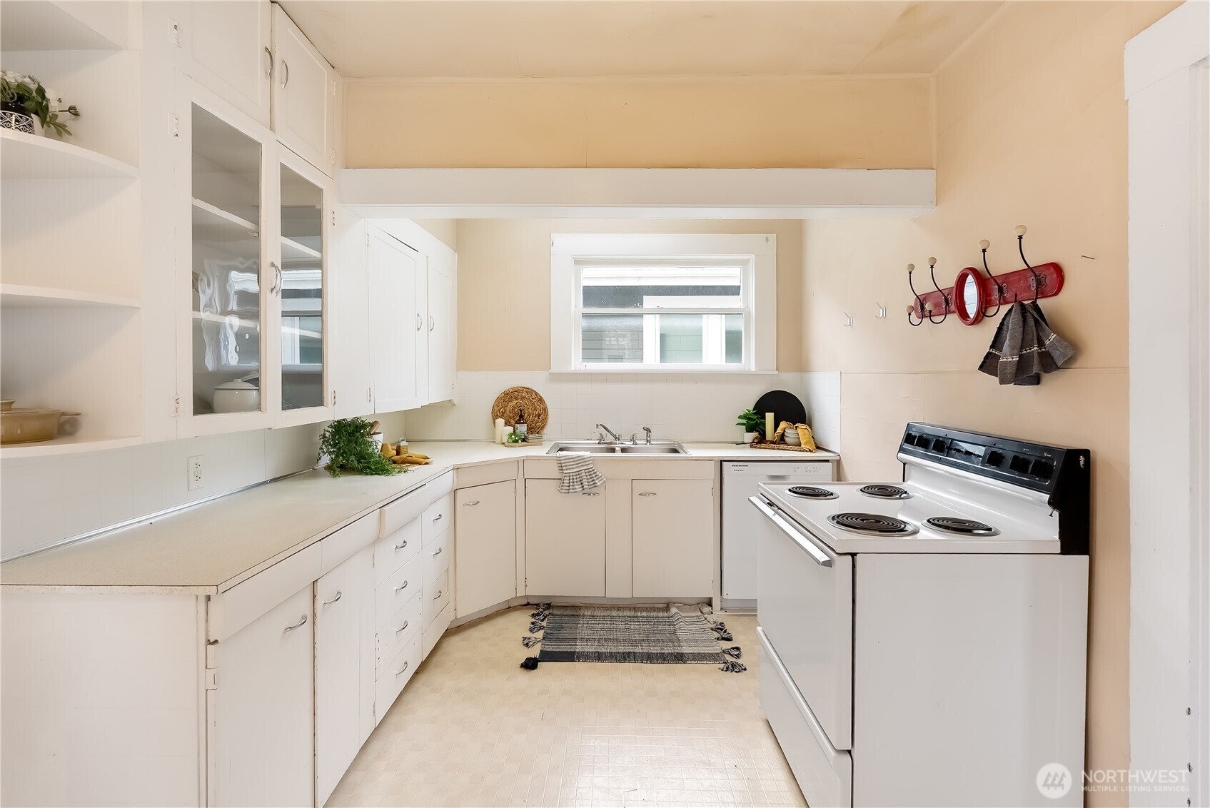 2414 Elm Street Bellingham, WA 98225 - Photo 14 of 36 a kitchen with cabinets and window