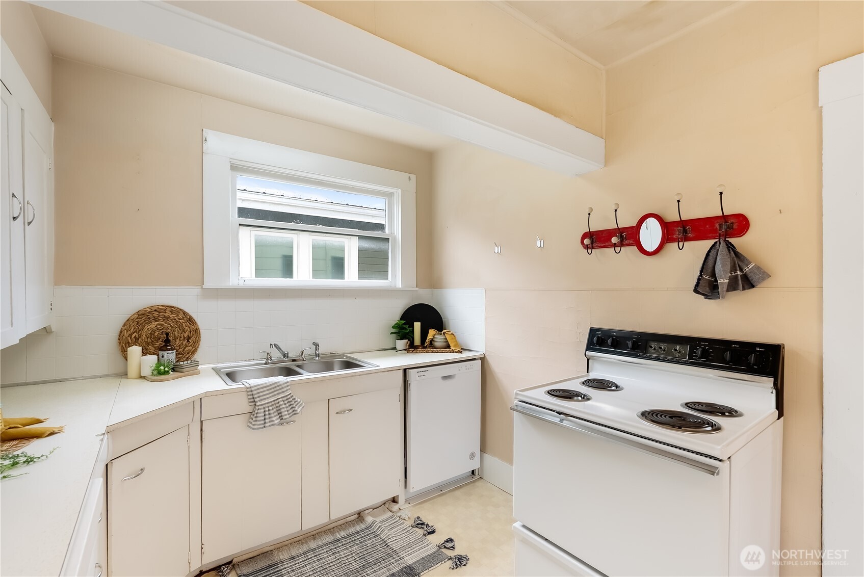 2414 Elm Street Bellingham, WA 98225 - Photo 15 of 36 a kitchen with a sink a stove and cabinets