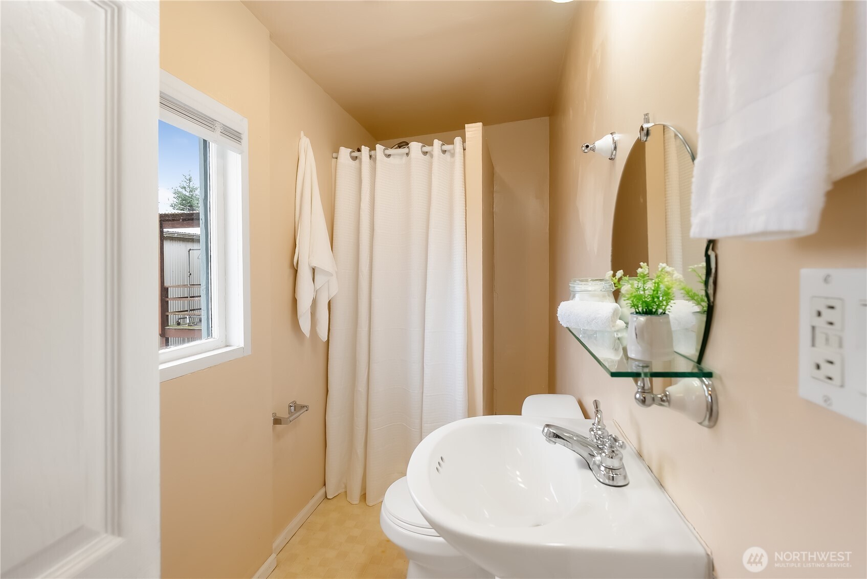 2414 Elm Street Bellingham, WA 98225 - Photo 20 of 36 a bathroom with shower a sink and a mirror